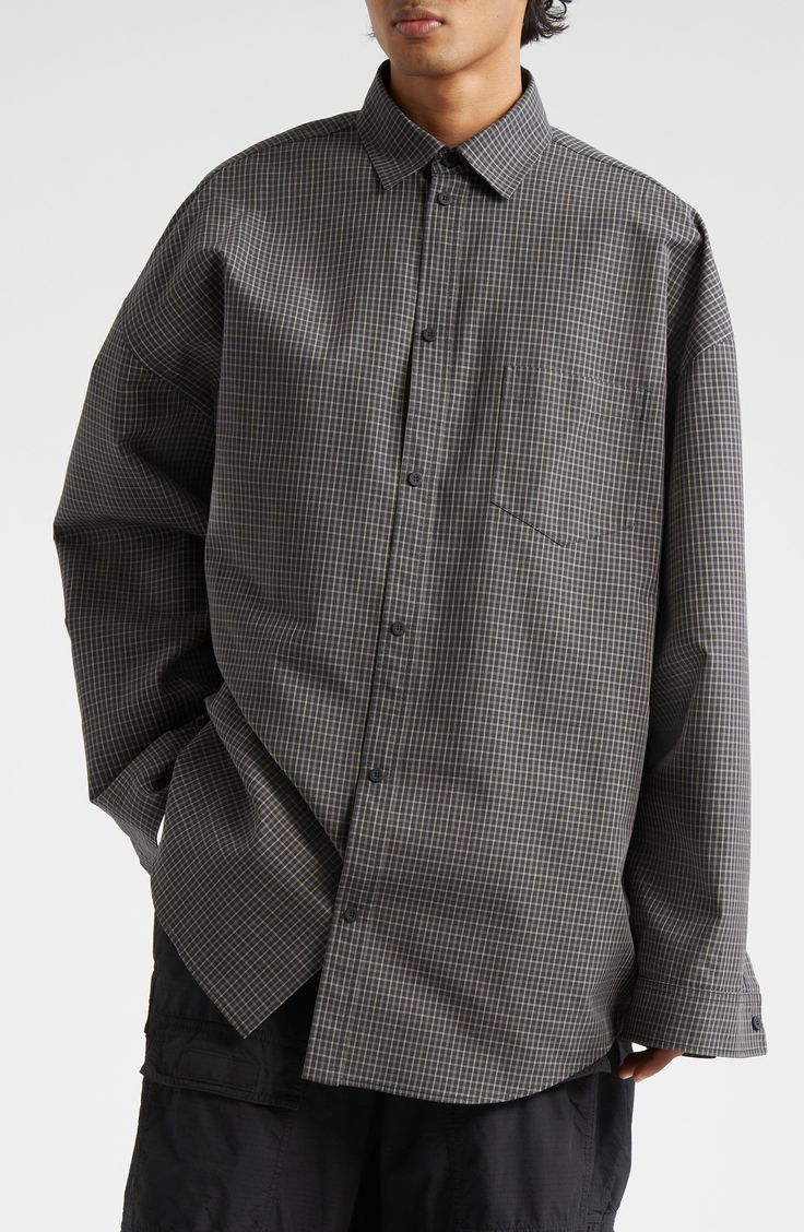 An oversized shirt is nothing new in the Balenciaga pantheon, but the twist here is that it's more of a jacket masquerading as a shirt (and no actual twist). What appear to be a proper button placket and button cuffs are camouflage for snap closures, bringing stealth jacket function to the voluminous cotton-poplin style. 29" length (size medium) Front snap closure Spread collar Long sleeves with snap cuffs Dropped shoulders Chest patch pocket Curved hem 100% cotton Dry clean Made in Italy Design Classic Oversized Winter Shirt, Classic Oversized Shirt For Winter, Oversized Gray Long Sleeve Shirt, Oversized Long Sleeve Shirt In Gray, Oversize Shirt, Nothing New, Italy Design, Oversized Shirt, Button Placket