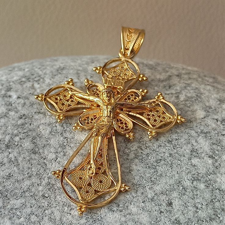 Byzantine style filigree work Orthodox Cross made of 18 ct. solid yellow gold , The Cross consist of two different pieces, the basic Cross which is decorated with different sizes filigree work spirals and the upper piece which is the Crucifix. The Cross is made in Greece In one of the oldest jewelry workshops in Athens that specialized in making filigree work specifically Crosses With over 250 different Cross designs based on Greek handmade art An amazing handmade Byzantine Cross that can be a s Byzantine Style Filigree Jewelry Gift, Antique Yellow Gold Crucifix Jewelry, Traditional Yellow Gold Baroque Jewelry, Ornate Baroque Yellow Gold Jewelry, Traditional Baroque Yellow Gold Jewelry, Byzantine Filigree Pendant Jewelry, Byzantine Style Filigree Pendant Jewelry, Byzantine Style Jewelry With Intricate Design For Gift, Byzantine Jewelry With Intricate Design For Ceremonial Occasion