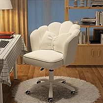 a white office chair sitting in front of a desk with a laptop computer on it