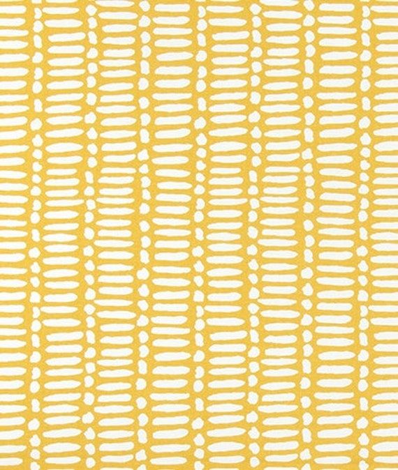 a yellow and white striped background with small circles on the bottom, in different sizes