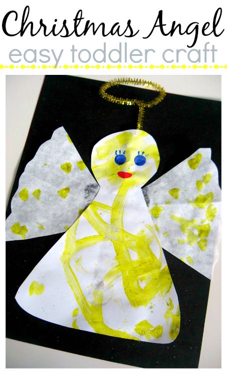 an angel made out of construction paper on a black and white background with gold foil