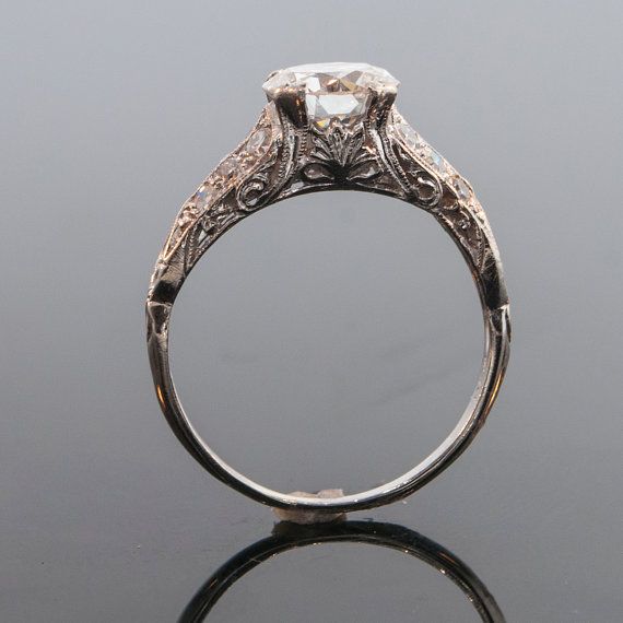 an antique diamond ring with filigree details