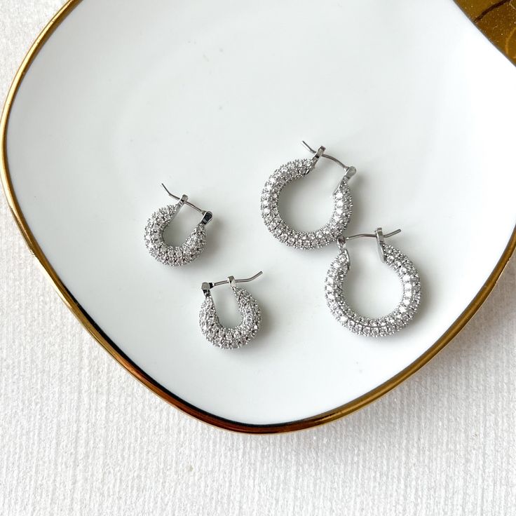 Our Ella Crystal Studded Hoop Earrings are modern, minimalist huggies with the just right amount of bling! Gold Plating on brass with cubic zirconia. Medium : diameter about 7/8 in. Small: diameter a little less than 5/8 in. Earrings are FINAL SALE for hygienic reasons Belly Chain, Moon Earrings, Hoop Earrings Small, Metal Earrings, Gold Plating, Vintage Metal, Layered Necklaces, Modern Minimalist, Statement Earrings