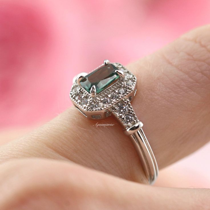 Gorgeous Vintage Inspired Tourmaline Ring ►Made of solid sterling silver with rhodium finish (925) ►Accented With Simulated Diamonds (CZ) ►Average band width: 2.3 mm ►Halo size: 9.9mm x 8.3mm Center Stone: Tourmaline Shape: Emerald Measurements: 4.0 x 6.0 mm Carat Weight: 0.7 ct. (approx.) Gemstone creation: 100% Natural Hardness: 7-7.5 (Mohs scale) ✓ 100% Nickel-Free ✓ Hypoallergenic ✓ Comfort Fit ✓ Free Ring Box ✓ Free USA Shipping *All listing photos are subject to copyright. *All rights rese Classic Princess Cut Emerald Ring With Halo Setting, Classic Emerald Cut Stackable Promise Rings, Vintage Diamond Ring With Center Stone For May Birthstone, Classic Design Anniversary Rings, Classic Emerald Stackable Rings With Prong Setting, Classic Emerald-cut Stackable Rings For Anniversary, Classic Promise Crystal Ring With Gemstone, Classic Emerald Cut Stackable Rings For Anniversary, Classic Emerald Cut Stackable Anniversary Rings