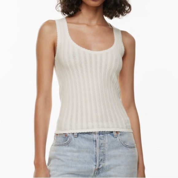 This Is A Fully Fashioned Scoopneck Top. It’s Knit With Wonder Yarn The Lightweight Yarn That Lives Up To Its Name. This Peachy Soft Yarn Offers The All-Season Warmth Of Wool, Without The Wool. It’s Made With Lenzing Ecovero Viscose Responsibly Sourced Wood-Based Fibres Produced Through A Process That Reduces Impact On Forests, Biodiversity And Water Supply. It’s Constructed Using A Pointelle Stitch For A Delicate Look And Airy Feel. Features Fully Fashioned Construction Means Your Knitwear Fits Elegant Crew Neck Tank Top For Summer, Chic Scoop Neck Knit Top For Spring, Chic Spring Knit Top With Scoop Neck, Chic Fitted Knit Top With Scoop Neck, Stretch Fine Knit Scoop Neck Top, Summer Seamless Scoop Neck Knit Top, Seamless Scoop Neck Knit Top For Summer, Fitted Fine Knit Crew Neck Tank Top, Chic Fitted Scoop Neck Knit Top