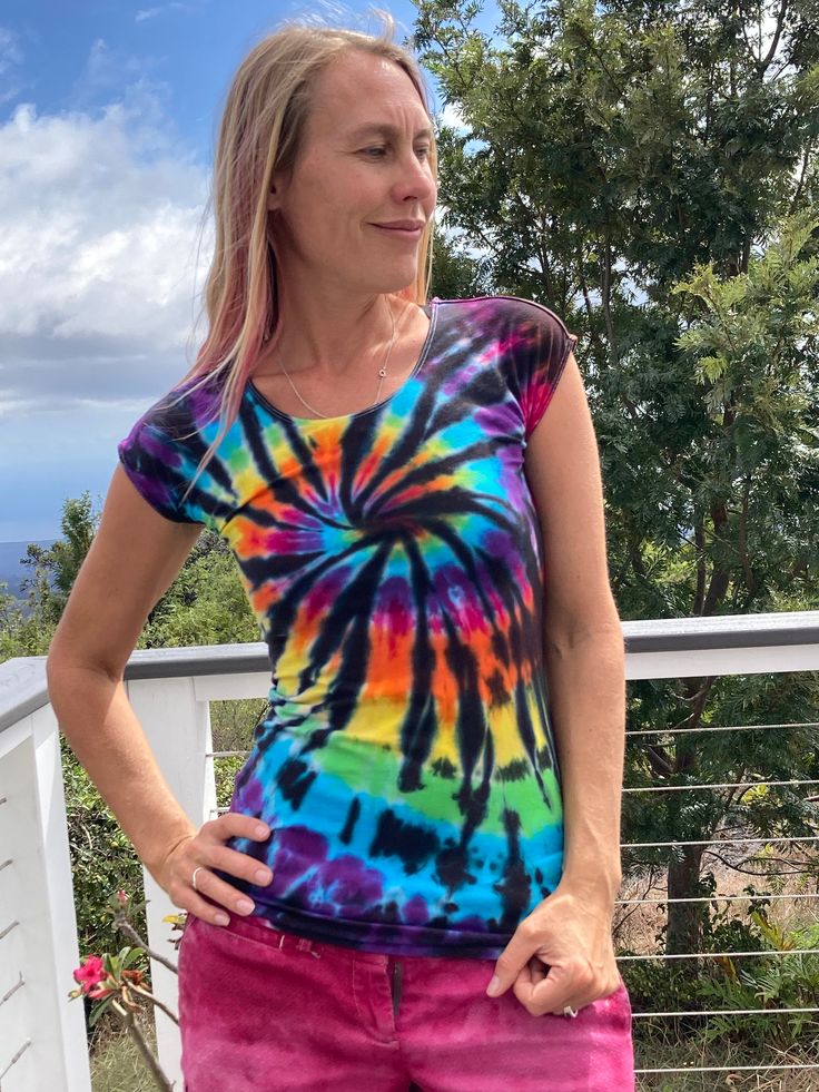 "Here is a beautiful previously loved DE Collection shirt hand dyed in wonderful colors.  55% cotton, 40% modal, 5% spandex Size M. Chest measures 32\" and stretches to 42\". Overall length measures 25\" This is a one of a kind shirt! Grab it while it's here! 604" Summer Fitted Acid Wash T-shirt, Spring Fitted Tie Dye T-shirt, Fitted Acid Wash Short Sleeve T-shirt, Spring Fitted Tie-dye T-shirt, Fitted Acid Wash T-shirt, Fitted Casual Rainbow Tops, Fitted Rainbow Casual Top, Rainbow Fitted Crew Neck Top, Fitted Rainbow Crew Neck Top