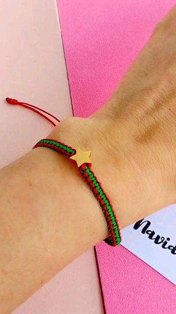 a person wearing a bracelet with a star on it