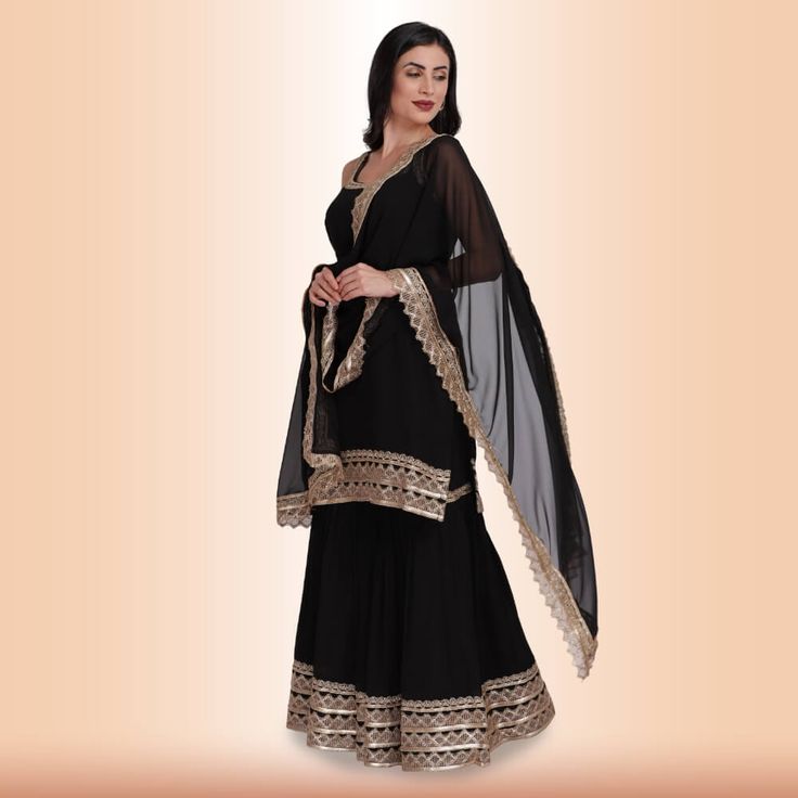 Introducing our new Elegant Garara Set with Gold Accent - Black! This garara set is perfect for any special occasion, whether you're attending a wedding or just want to dress up for a night out. The heavy gold gota accents on the edge of the top, garara, and dupatta add a touch of luxury, while the simple design keeps it elegant and timeless. We know you'll love this garara set as much as we do! Fabric for sleeves is included in all of our clothing, unless specified otherwise. Simple Garara Design, Pakistani Garara Dresses, Black Garara, Mehndi Gharara, Black Gharara, Garara Design, Garara Designs, Black Sharara, Garara Dress