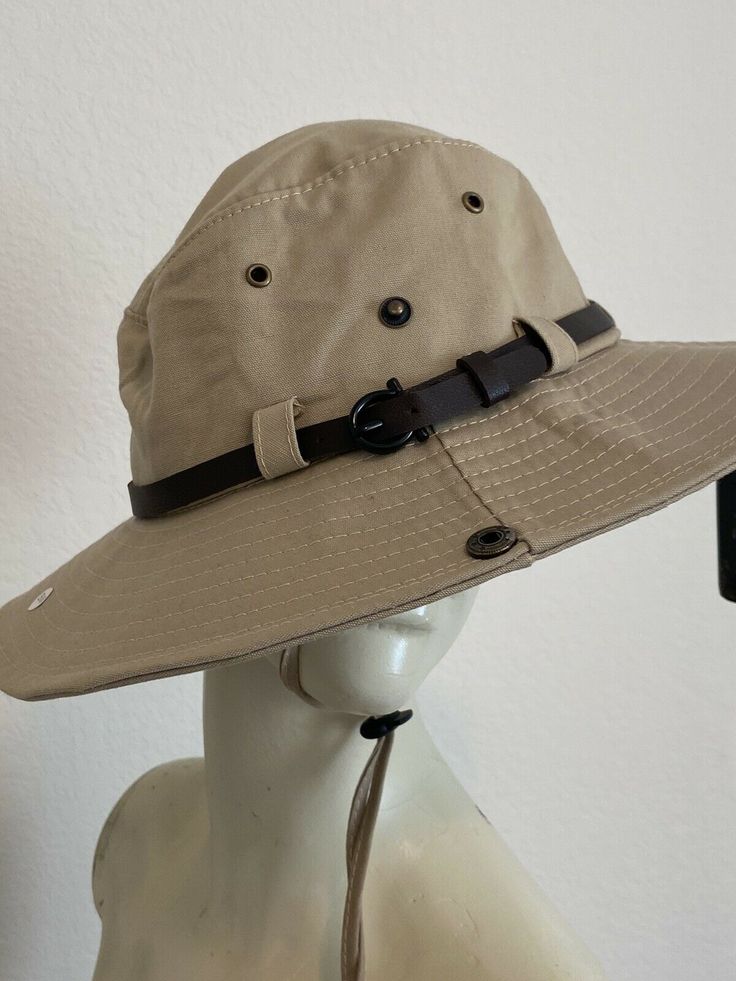 The Lord liveth; and blessed be my rock; and let the God of my salvation be exalted.. PSALM 18:46 FEATURES New with tags.  Hat features vents, side button snaps, faux leather band and adjustable chin cord. FLAWS N/A BRAND Westend COLOR Khaki/Tan SHELL FABRIC/MATERIAL 100% Cotton SIZE S/M For reduce cost shipping, items will wrinkle in transit. Environment My home is smoke free and pet free.  I sell items from my closet, as well as items purchased from thrift stores and retails store.  For thrift