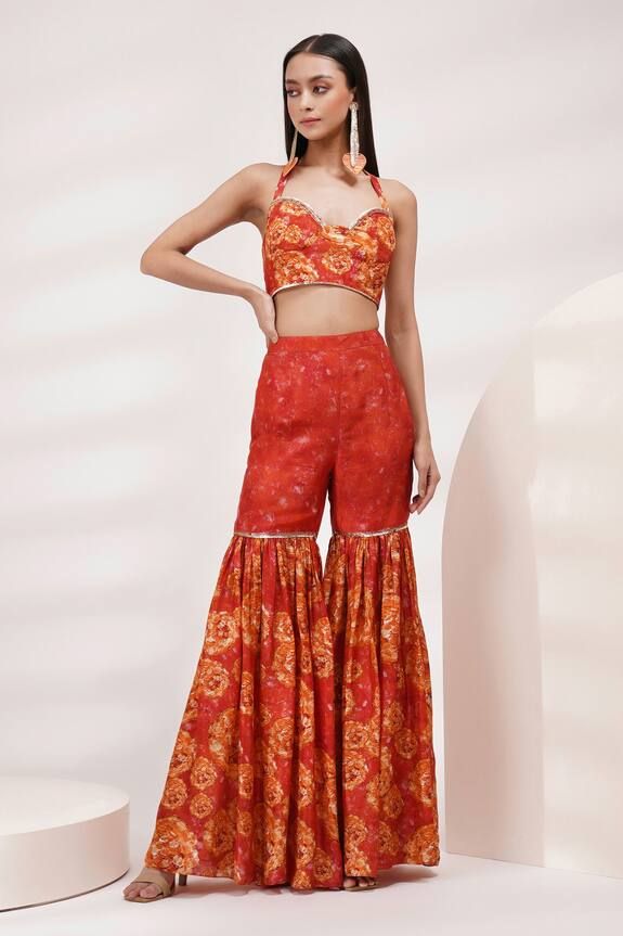 Coral orange padded blouse with floral print and sequin embroidered border. Paired with attached cancan sharara and dupatta. - Aza Fashions Aakanksha Singh, Halter Neck Blouses, Women Kurta, Padded Blouse, Embroidered Border, Luxury Sale, Sharara Set, Coral Orange, Cotton Voile