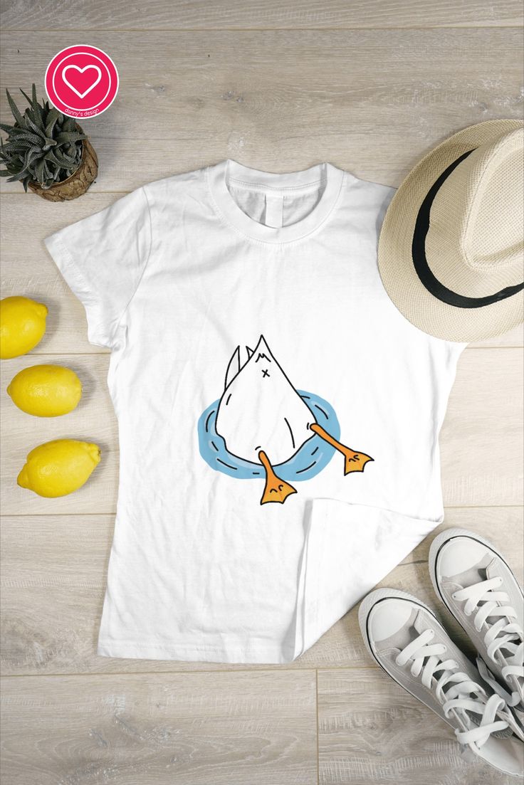 This design features a cartoon duck with a cute and plump butt and adorable webbed feet. The exaggerated features give this duck a playful and charming look that's sure to make you smile. Perfect for animal lovers or anyone who appreciates whimsical and cute designs. The standard, traditional t-shirt for everyday wear. Classic, generous, boxy fit. Solid colors are 100% preshrunk cotton, heather grey is 90% cotton/10% polyester, denim heather is 50% cotton/ 50% polyester. #duck #tshirt #funny Duck Shirt, Tshirt Funny, A Cartoon, Animal Lovers, You Smile, In Water, Cute Shirts, Ducks, Make You Smile