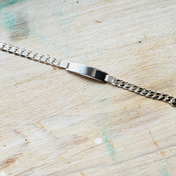 Sterling silver curb ID bracelet. Lenght: 20 cm. All items in our shop will be shipped in a gift box. All items in this shop are hand made by Luxoro Design team. Please take a look at other items in our store: https://www.etsy.com/shop/LuxoroAmberDesign?ref=seller-platform-mcnav Thank you for visiting our store. Cuban Link Chain Bracelet Engraved Gift, Engraved Cuban Link Bracelets As Gift, Classic Silver Name Bracelet With Bracelet Strap, Classic Silver Name Bracelet With Strap, Silver Curb Chain Bracelets For Gift, Silver Curb Chain Bracelets As Gifts, Adjustable Silver Bracelet With Curb Chain, Silver Jubilee Name Bracelet, Sterling Silver Curb Chain Bracelet Gift