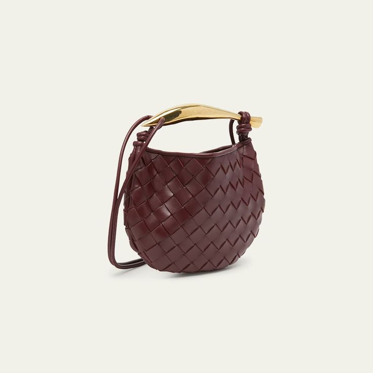 Bottega Veneta top handle bag in  intrecciato  lambskin leather Knotted thing crossbody strap  Metal top handle  Open top with magnetic closure  Approx. 4.7"T x 7.9"W x 0.9"D Made in Italy Luxury Crossbody Bags For Errands, High-end Shoulder Bag With Detachable Handle For Shopping, High-end Tote Bag With Gold-tone Hardware, Designer Top Handle Baguette Bag For Errands, High-end Crossbody Bag With Detachable Handle, High-end Bag With Top Handle And Removable Pouch, Luxury Satchel With Detachable Handle For Errands, High-end Bag With Removable Pouch And Top Handle, High-end Shoulder Bag With Removable Pouch For Shopping