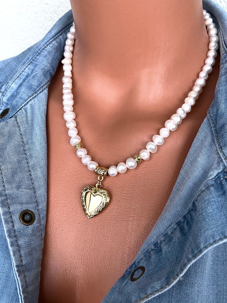 Fresh Water Pearl Necklace with Gold Plated Heart Shaped Locket Pendant This elegant necklace set is a great gift for yourself and your loved ones. Made from natural pearl beads. All metal ornaments are gold plated and won't get darker in time! FREE SHIPPING - All orders get shipped within 1-2 business days. - 5-10 days of delivery time Returns are allowed 14 days after the delivery, however, the cost of delivery lies on the buyer. For more bracelets and necklaces!: https://finecrystalsdesign.etsy.com How to care for your necklace: * Avoid getting moisture, alcohol and perfume, if you do please dry the product with clean cloth. Please take off your necklace before swimming or taking shower. White Heart Beads Jewelry For Mother's Day, Wedding Pearl Charm Heart Pendant Jewelry, Gold Pearl Necklace With Heart Charm For Anniversary, Heart-shaped Pearl Necklace For Anniversary, Heart-shaped Jewelry For Mother's Day, White Locket Jewelry For Valentine's Day, Elegant Necklace For Valentine's Day, White Heart Necklace For Wedding On Valentine's Day, Elegant Necklace For Valentine's Day Special Occasion