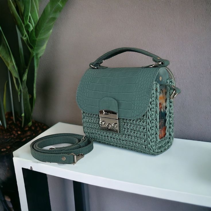 Crochet CrossBody Bag, Modern Stylish Bag SOFIA Elegant crocheted handbag with acrylic side panels. A modern and stylish accessory that exudes elegance and charm! Indulge in the artistry of handcrafted beauty, perfect for enhancing your daily life with a touch of sophistication. * Color: green * Item Care: Please Hand Wash * Perfect Gift Idea * Material: Polyester Rope *%100 Handmade Flap and handles made of leather. Dimensions: Bottom in size ~ 21x8 cm Height ~ 17cm Handle ~ 120 cm The Perfect Green Square Bag For Fashion, Trendy Rectangular Crochet Bag With Adjustable Strap, Rectangular Crochet Travel Bag With Detachable Handle, Chic Rectangular Crochet Bag With Adjustable Strap, Chic Crochet Bag With Adjustable Strap, Rectangular Crochet Bag With Adjustable Strap For Shopping, Rectangular Crochet Bag With Detachable Handle For Daily Use, Green Rectangular Crochet Bag With Removable Pouch, Crochet Bag With Detachable Handle For Daily Use