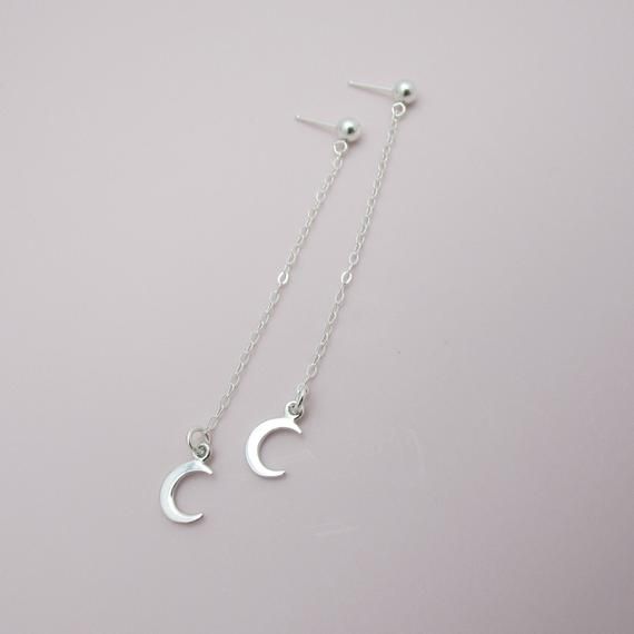 SOLID STERLING SILVER EARRINGSThese celestial earrings make a wonderful gift. The real sterling ear studs are adorned with a tiny moon that dangles elegantly on sterling silver chain. Comes in a gift box, perfect for gift giving. Total earring length is approximately 2 3/4 inches long. ALSO AVAILABLE IN A STAR DESIGN OR MOON/STAR COMBO Minimalist Silver Moon Phase Earrings, Moon Shaped Sterling Silver Earrings For Everyday, Sterling Silver Moon Earrings For Everyday, Sterling Silver Moon Shaped Earrings For Everyday, Dainty Moon Phase Earrings, Sterling Silver Moon Charm Earrings For Everyday, Minimalist Silver Crescent Earrings, Minimalist Silver Moon Earrings, Minimalist Crescent Sterling Silver Earrings