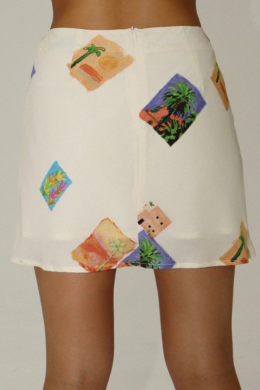 print mini skirtfully lined, rear zipper measurements are taken from a size smallwaist - 26"length - 15.5" content & care 100% polyester hand wash cold, hang to dry, low iron if needed Chic White Skort With Floral Print, Chic White Floral Print Skort, Printed Mini Skirt For Vacation, Summer Mini Skirt With Floral Print, Chic Printed Mini Skirt, Cream Mini Skirt With Lining, Summer Floral Print Mini Skort, Cream Mini Skirt With Lined Detail, White Floral Print Skort For Vacation