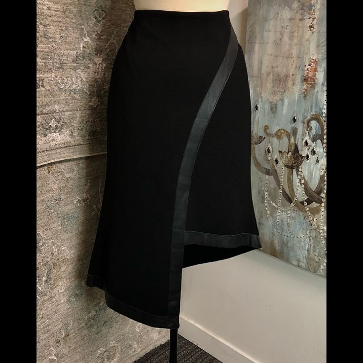 Leather Detail Fitted Skirt For Workwear With Asymmetrical Hem, Fitted Asymmetrical Skirt For Work, Chic Asymmetrical Skirt For Office, Chic Asymmetrical Wrap Skirt For Office, Black Asymmetrical Skirt For Formal Occasions, Asymmetrical Black Skirt For Evening, Chic Asymmetrical Cocktail Skirt, Fitted Asymmetrical Bottoms For Office, Fitted Asymmetrical Office Bottoms