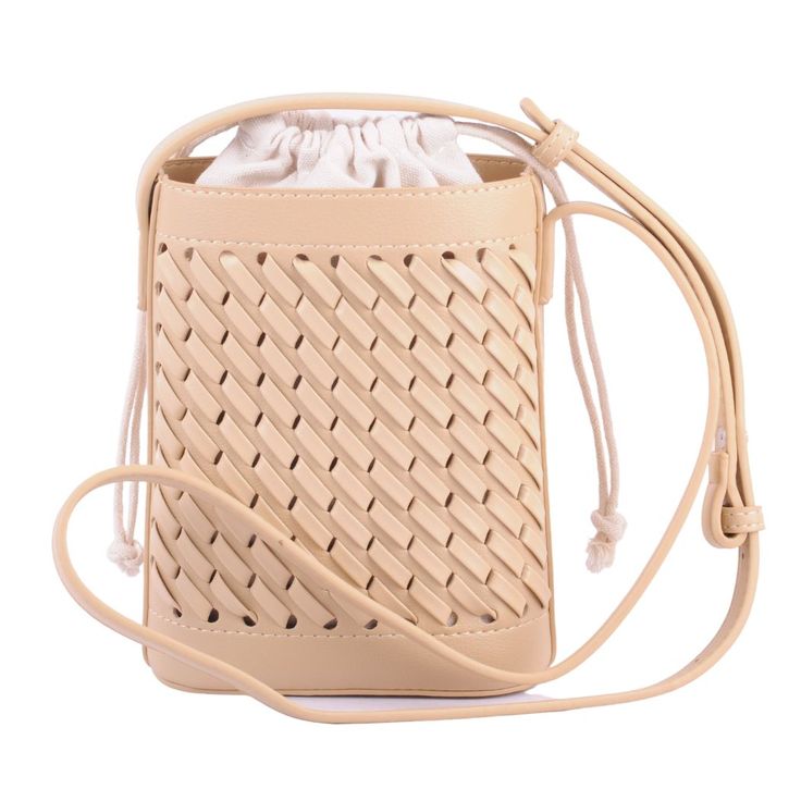 This crossbody bag features a built in drawstring bag and an outer woven patterning on the vegan leather construction. This bag is a great day time option for keeping your essentials safe while also having your outfit looking on point. The available color options are black, beige, ivory, cognac, and muted teal. Woven Leather Crossbody Bucket Bag For On-the-go, Casual Woven Leather Pouch Shoulder Bag, Beige Woven Leather Crossbody Bucket Bag, Daily Use Woven Leather Pouch Bucket Bag, Daily Use Woven Leather Bucket Bag, Casual Woven Leather Bucket Bag For Travel, Casual Woven Crossbody Bucket Bag, Casual Bucket Bag With Cell Phone Pocket, Rectangular Woven Leather Shoulder Bag For Day Out