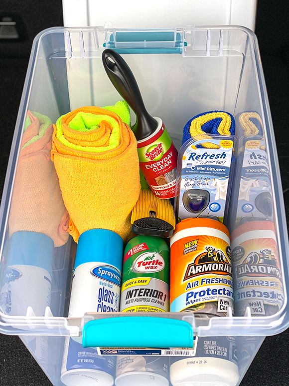 a plastic container filled with cleaning supplies