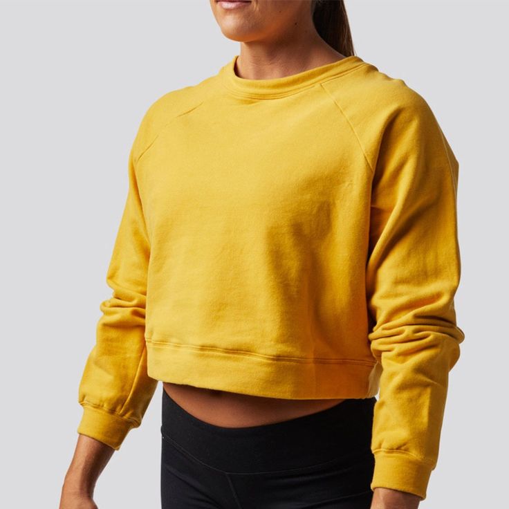 95% Cotton, 5% Spandex Machine Wash Cold With Like Colors. Hang Dry. Cuffed Sleeves Crew Neck Cropped Yellow Casual Top With Ribbed Cuffs, Casual Yellow Top With Ribbed Cuffs, Yellow Relaxed Fit Sweatshirt For Loungewear, Yellow Sporty Sweatshirt With Relaxed Fit, Yellow Relaxed Fit Sporty Sweatshirt, Yellow Sporty Relaxed Fit Sweatshirt, Yellow Cotton Tops With Ribbed Cuffs, Yellow Crew Neck Top For Winter, Fall Crew Top With Stretch