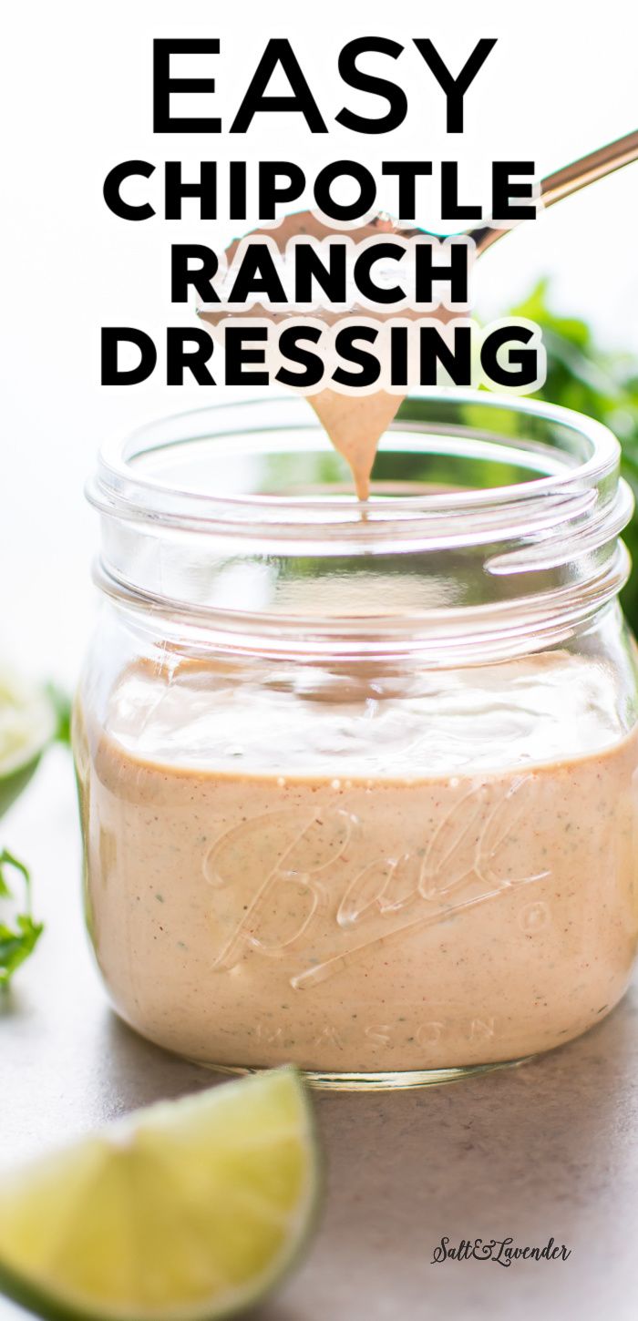 an easy chipotle ranch dressing in a mason jar with limes and cilantro