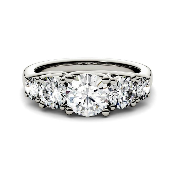 three stone engagement ring with diamonds on the sides