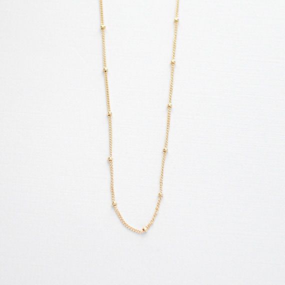 H I G H L I G H T S• Non-Tarnishing 14k Gold Filled Chain • Lobster Clasp Closure • Available In 14”, 16”, 18”, and 20” LengthsOur dainty gold necklaces are a great way to carry your most special moments with you! These simple and minimal necklaces are made to suit anyone. Each item is made to order, so you know your piece will be completely unique to you or your recipient! O R D E R I N G1. Select the options from the drop down box2. Add to cartA B O U T • T H I S • P I E C E This necklace is m Delicate Everyday Jewelry With Ball Chain, Minimalist Tiny Beads Chain Necklace For Everyday, Minimalist Tiny Beaded Necklaces For Layering, Dainty Station Necklace With Satellite Chain As Gift, Dainty Station Necklace With Satellite Chain, Dainty 14k Gold-filled Satellite Chain Necklace, Dainty Ball Chain Necklace For Everyday, Dainty Everyday Ball Chain Necklace, Dainty Everyday Necklace With Beaded Chain