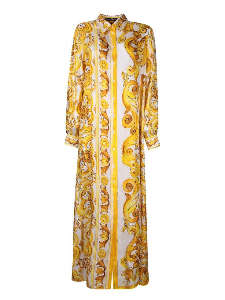 Long dress in light and breathable fabric with Maiolica print. Features frontal button closure and a classic collar.. This Dolce & Gabbana long dress captivates with its lively yellow and gold Maiolica print, offering an elegant cut that gently cascades down the body. Perfect for spectacular occasions or a sophisticated evening outGender: WomenMaterial: 100% SILKColor: YELLOWMade in: ImportedProduct ID: F6JDET HI1TK HG3TN*Import tax/duty will be calculated at checkout (If applicable) Luxury Baroque Print Dress, Luxury Gold Maxi Evening Dress, Designer Printed Summer Dresses, Elegant Yellow Printed Dress, Luxury Yellow Silk Dresses, Gold Floral Print Maxi Dress, Elegant Silk Dress With Baroque Print, Yellow Long Printed Maxi Dress, Yellow Printed Long Maxi Dress