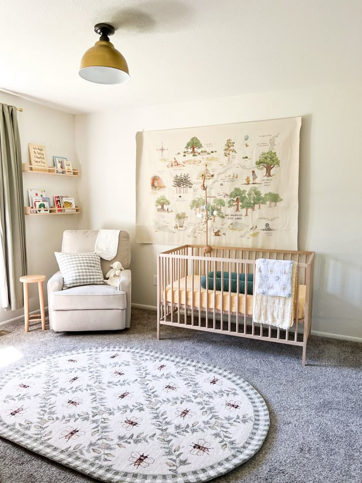 a baby's room with a crib, chair and rug