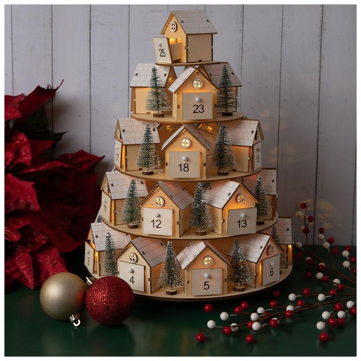 a christmas tree made out of wooden houses