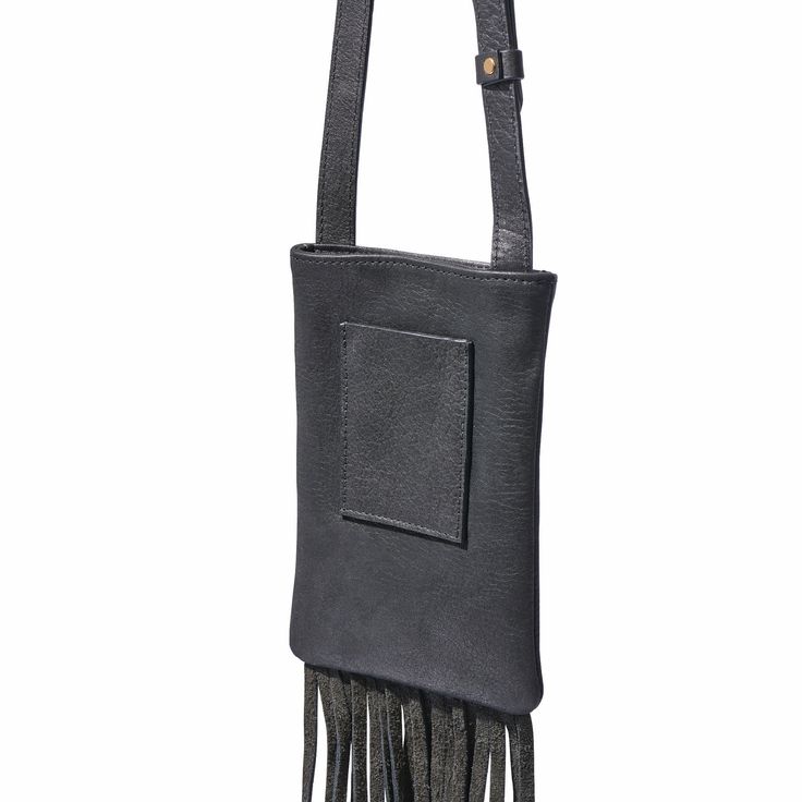 Fringe Phone Bag – Handcrafted in Regenerative American Leather Discover the perfect blend of beauty and practicality with our luxuriously soft Fringe Phone Bag. Designed to comfortably hold your phone, keys, and everyday essentials, this stylish bag features a magnetic snap closure to keep your items secure. Key Features: Spacious Interior: The fully lined interior includes a convenient card pocket on the backside, providing organized storage for your essentials. Unique Design: Showcasing long, Soft Fringe, Organized Storage, The Fringe, American Leather, Stylish Bag, Everyday Essentials, Phone Bag, Snap Closure, Everyday Essentials Products