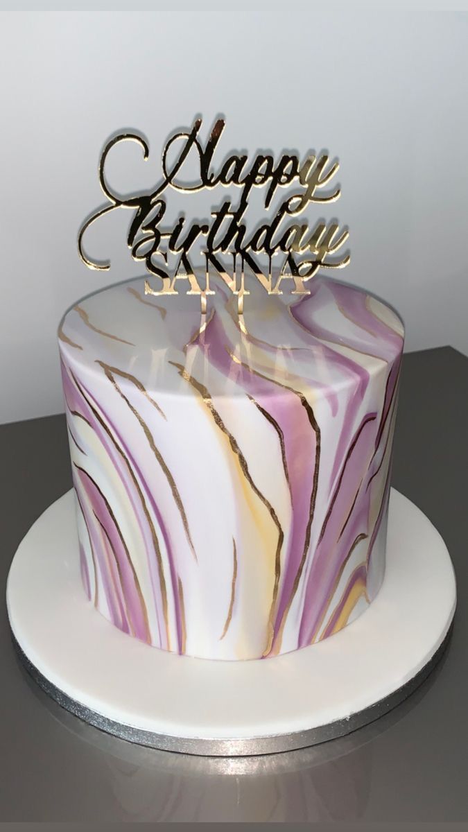 a marbled birthday cake with the words happy birthday on top