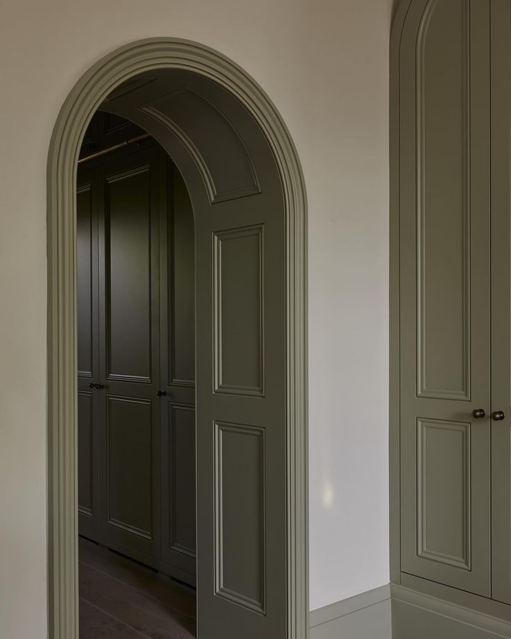 an arched doorway leading to another room