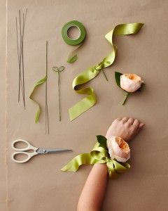 someone is making flowers out of ribbon and scissors