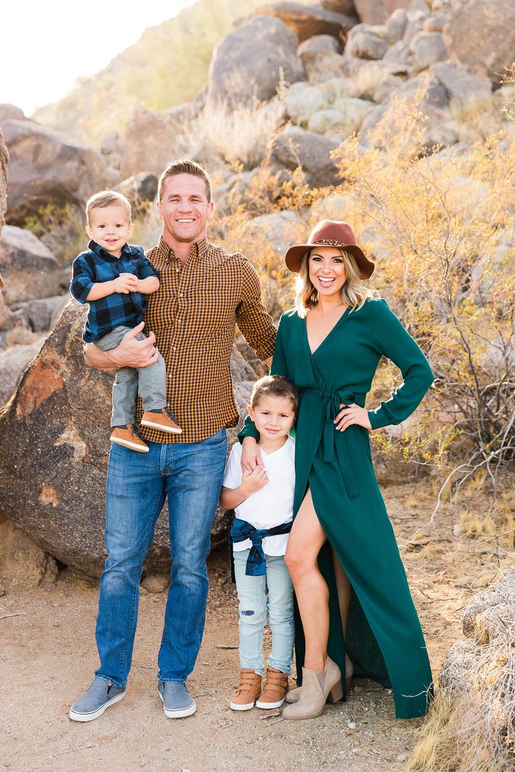 a family posing for a photo in the desert