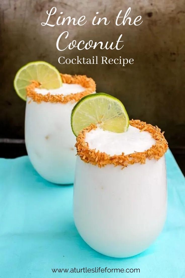 two glasses filled with coconut drink and garnished with lime