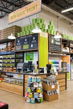 the interior of a paint shop filled with lots of different colors and products on display