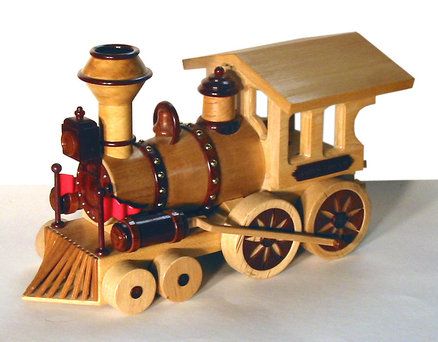 a wooden toy train is shown on a white background