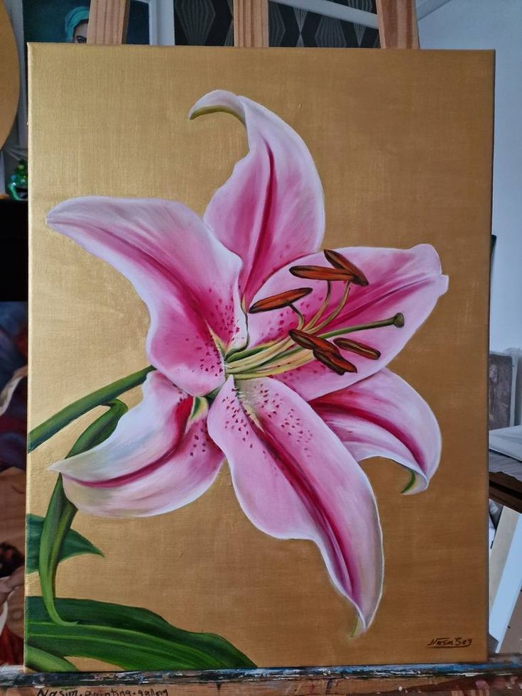 a painting of a pink flower on a canvas