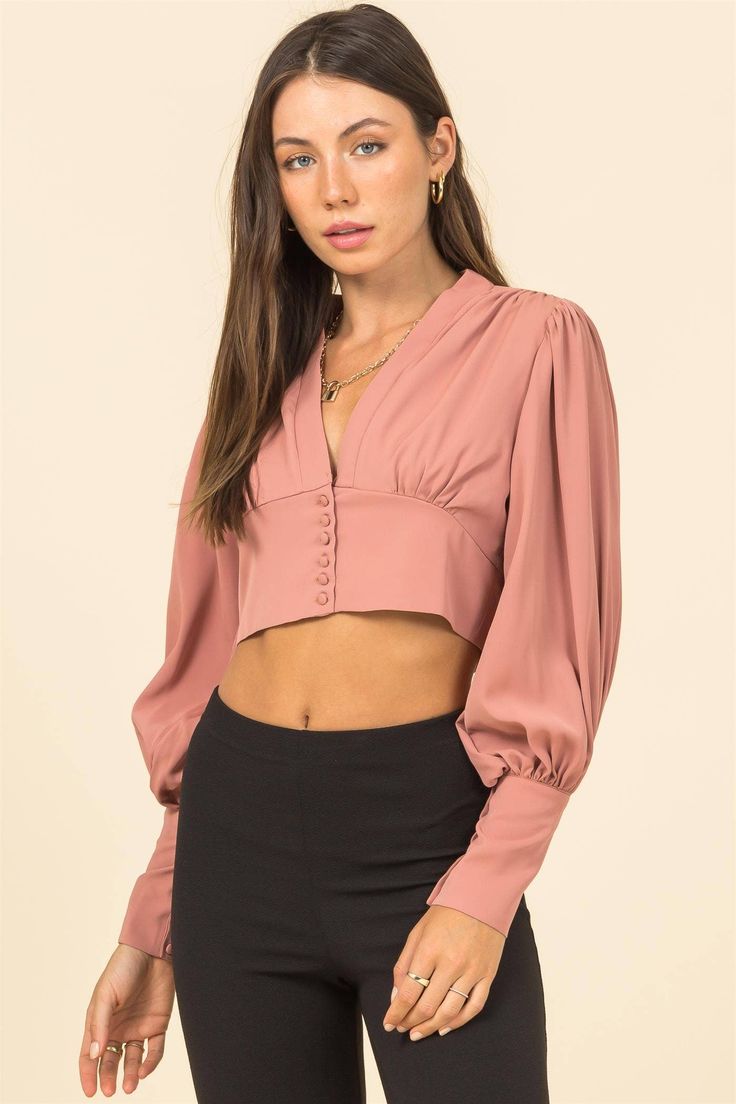 100% polyester Model is 5' 8", 32' chest, 24' waist and 34' hips and wearing a size small. Available in black or pink. Fitted Feminine Solid Blouse, Chic Fitted Blouse With Balloon Sleeves, Fall Puff Sleeve Crop Top, Fall Puff Sleeve Blouse For Night Out, Chic Padded Blouse Crop Top For Fall, Elegant Cropped Puff Sleeve Top For Fall, Fitted Puff Sleeve Blouse For Fall, Chic Pink Blouse For Fall, Pink Stretch Top For Date Night