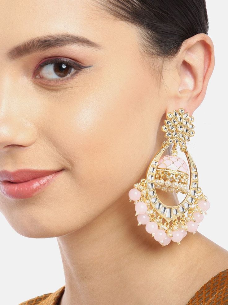 These beautiful light-pink dome shaped jhumka earrings come with kundan stone studs & beads, are gold-plated and are secured with a post and back closure. These handcrafted jhumkas can complement any traditional outfit to add a punch of subtle color, and help you stand out. Product color may vary based on the monitor or screen you are using.See FAQ for more details. Size Length: 9.5 cm Details Material: BrassStones: Kundan & Artificial BeadsPlating: Gold-plated Gold Kundan Beaded Earrings, Kundan Beaded Earrings For Festivals, Pink Kundan Chandelier Earrings For Festive Occasions, Pink Kundan Earrings For Eid, Gold Jhumkas With Mirror Work, Chandbali Mirror Work Jhumkas, Chandbali Jhumkas With Mirror Work, Mirror Work Chandbali Jhumkas, Pink Round Jhumkas For Wedding