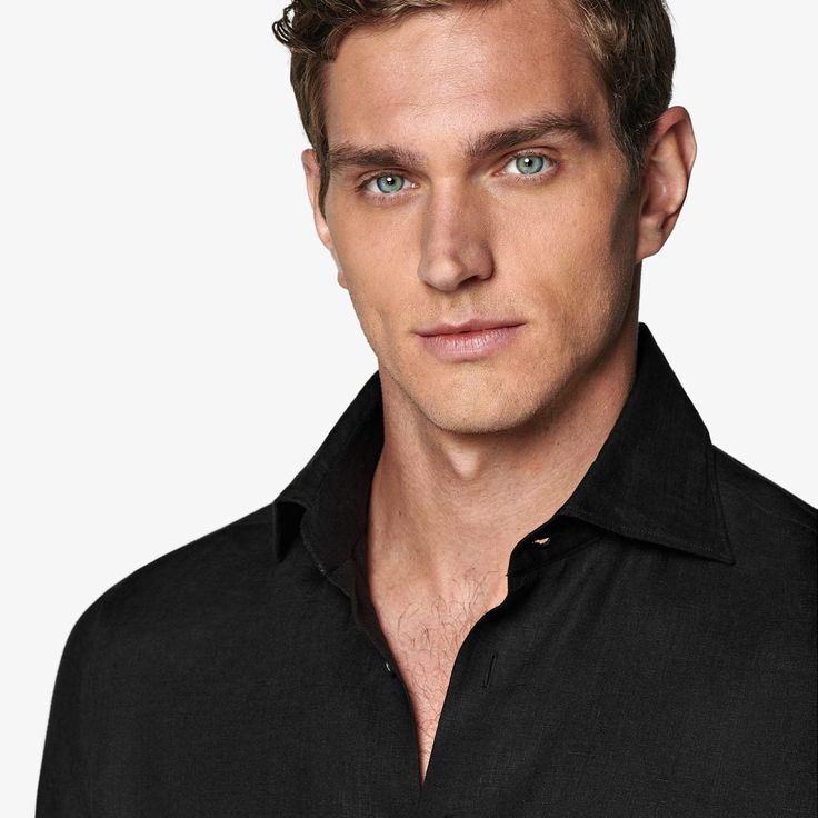 A refined take on relaxed, this sleek black shirt is tailored with a tapered waist for a modern fit, detailed with ultra-fine stitching and soft interlining, and boasts a subtly curved hem that's ideal for a clean untucked look. Timeless Business Top With Concealed Placket, Timeless Business Top With Fold Down Collar, Timeless Business Top With Fold-down Collar, Modern Business Tops With Spread Collar, Modern Formal Top With Lapel Collar, Formal Collared Linen Top, Modern Slim Fit Top For Semi-formal Occasions, Modern Black Shirt For Semi-formal Occasions, Sleek Black Slim Fit Tops