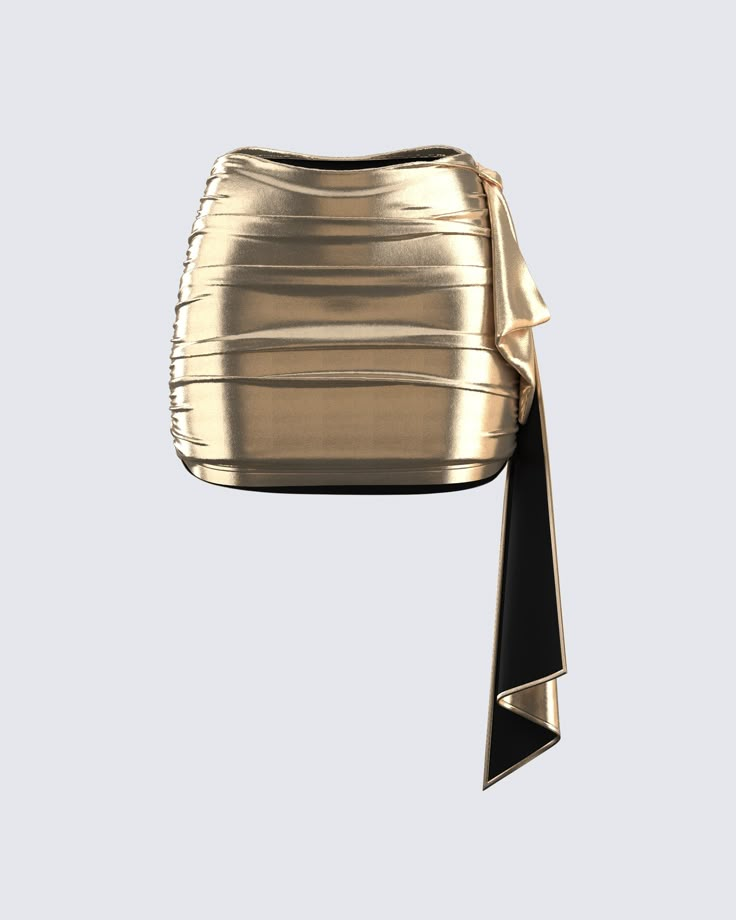 This golden drape skirt is your key to instant glam ✨ Made from lame jersey fabric, and complete with an asymmetrical hem, sash detail, ruching detail, and an elastic waistband - this skirt has a luminous allure perfect for stealing the spotlight anywhere you go 😌 Chic Ruched Evening Skirt, Chic Evening Ruched Skirt, Chic Evening Skirt With Ruched Details, Ruched Mini Skirt For Evening, Chic Ruched Draped Skirt For Night Out, Chic Metallic Skirt For Night Out, Chic Draped Skirt For Summer Parties, Chic Summer Draped Skirt For Party, Evening Draped Asymmetrical Skirt With Ruched Sides