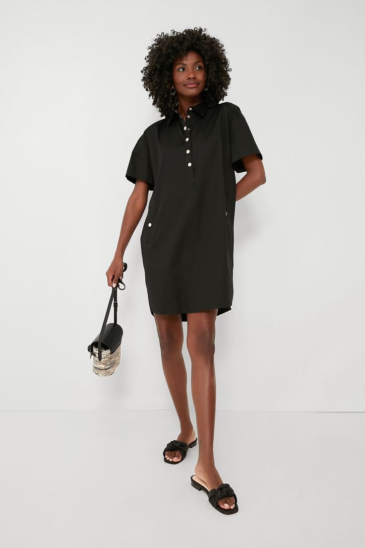 We tasked ourselves with giving the classic shirtdress a refresh, and this is the fabulous result. Keeping it simple yet elevated, the Black Oakley Dress is the definition of effortlessly chic. In a crisp cotton fabric that will drape perfectly and keep you feeling good no matter the weather, this mini features a sophisticated point collar, gold snaps down the partial placket and at the hip pockets, and a rounded hem. Wearable for nearly any occasion, this silhouette can do office days with loaf Chic Black Shirt Dress With Relaxed Fit, Casual Shirt Dress For Business Casual In Summer, Chic Black Relaxed Fit Shirt Dress, Summer Casual Shirt Dress For Business Casual, Chic Daywear Shift Shirt Dress, Summer Cotton Shirt Dress For Business Casual, Business Casual Collared Cotton Dress, Chic Cotton Knee-length Shirt Dress, Black Shirt Dress With Placket For Spring