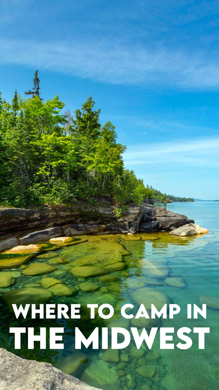 a lake with rocks and trees in the background that says, where to camp in the midwest