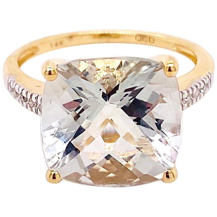 This dramatic ring has a huge genuine stone in the center accented with brilliant diamonds! It is quite striking and the 14 karat yellow gold is pure butter next to the gemstone. This ring is truly a ring fit for a queen! 14K Yellow Gold Gemstone: Green Amethyst Gemstone Weight: 6.04 Carats Diamond Weight: .07 Carats Total Diamond Weight Ring Size: 7 Stone Width: 12x12mm Band Width: 2-1.4mm Wide Total Weight: 6.11 Carats Total Gemstone & Diamond Weight Gram Weight: 3.73 Grams Statement Rings Diamond, Amethyst And Diamond Ring, Gold Cushions, Gem Ring, Star Jewelry, Ring Fit, Green Amethyst, Brilliant Diamond, Amethyst Gemstone