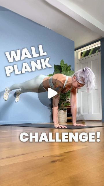 a woman doing a plank exercise with the words wall plank challenge in front of her