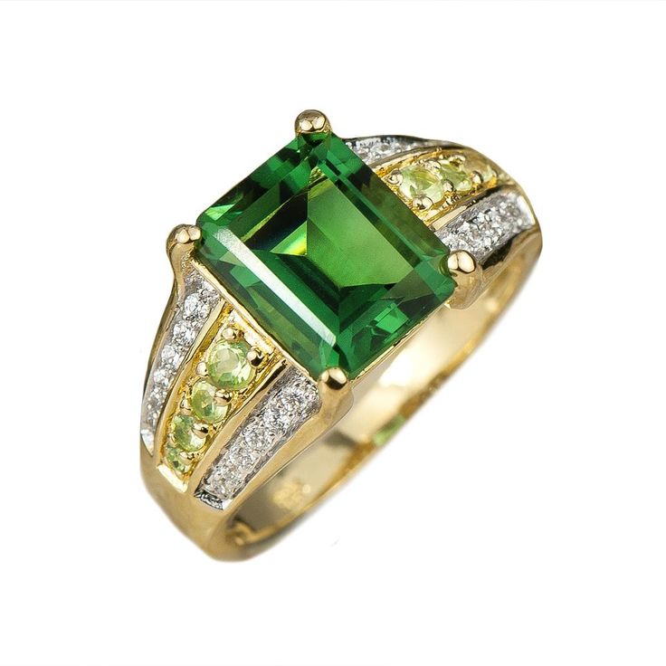 In the world of gemstones, green is actually one of the hardest stones to find in an attractive unflawed shade. That is why we were so pleased to find a consignment of these gorgeous Emerald cut Green Quartz gems in a stunning clear forest green color. We had our master jewelers specially design this striking 2 tone 18 k yellow gold plated setting from the finest 925 sterling silver to create our new Belvedere Ring. Magnificent presentation case included. Forest Green Color, Gold Watch Men, Ladies Ring, Green Quartz, Latest Jewellery, Men's Necklace, Mens Jewelry Bracelet, Stainless Steel Band, Love Necklace