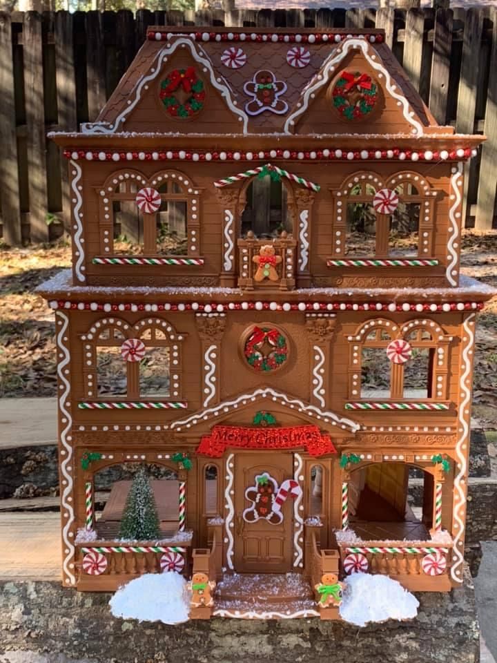 a large gingerbread house with decorations on it